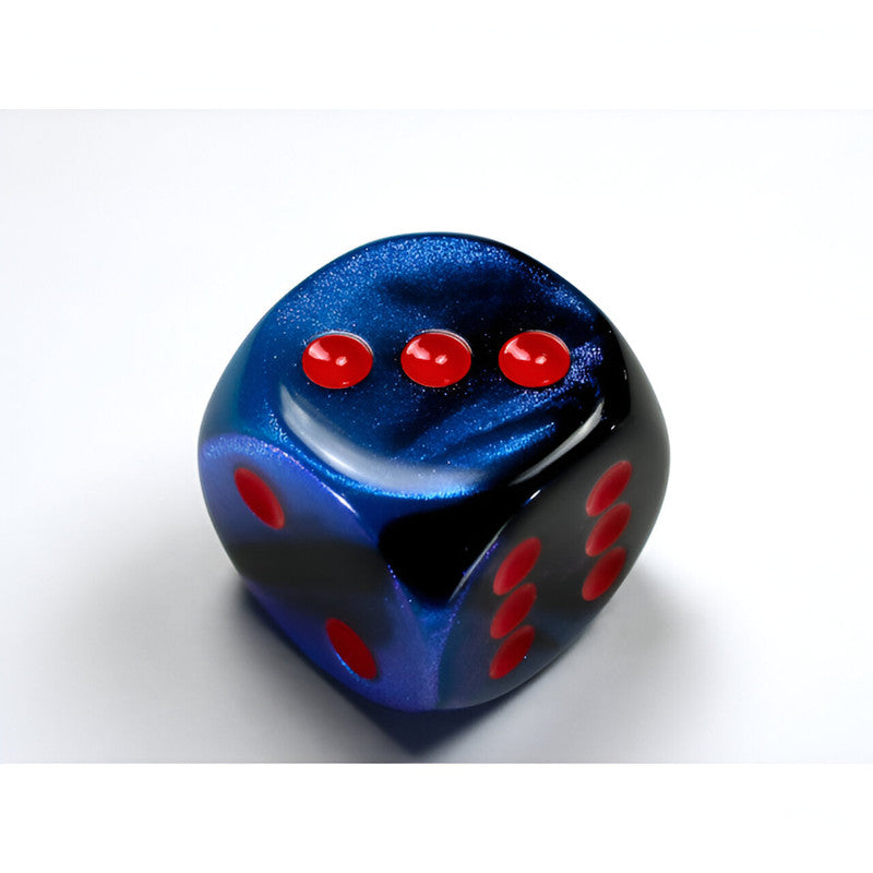A shimmering blue and black Chessex Gemini marbled d6 dice with red pips. The top face shows three, and the right face shows six