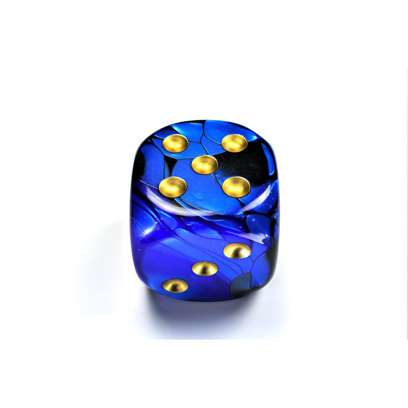 A Chessex Gemini blue and black marbled d6 dice with gleaming gold pips. The top face shows five