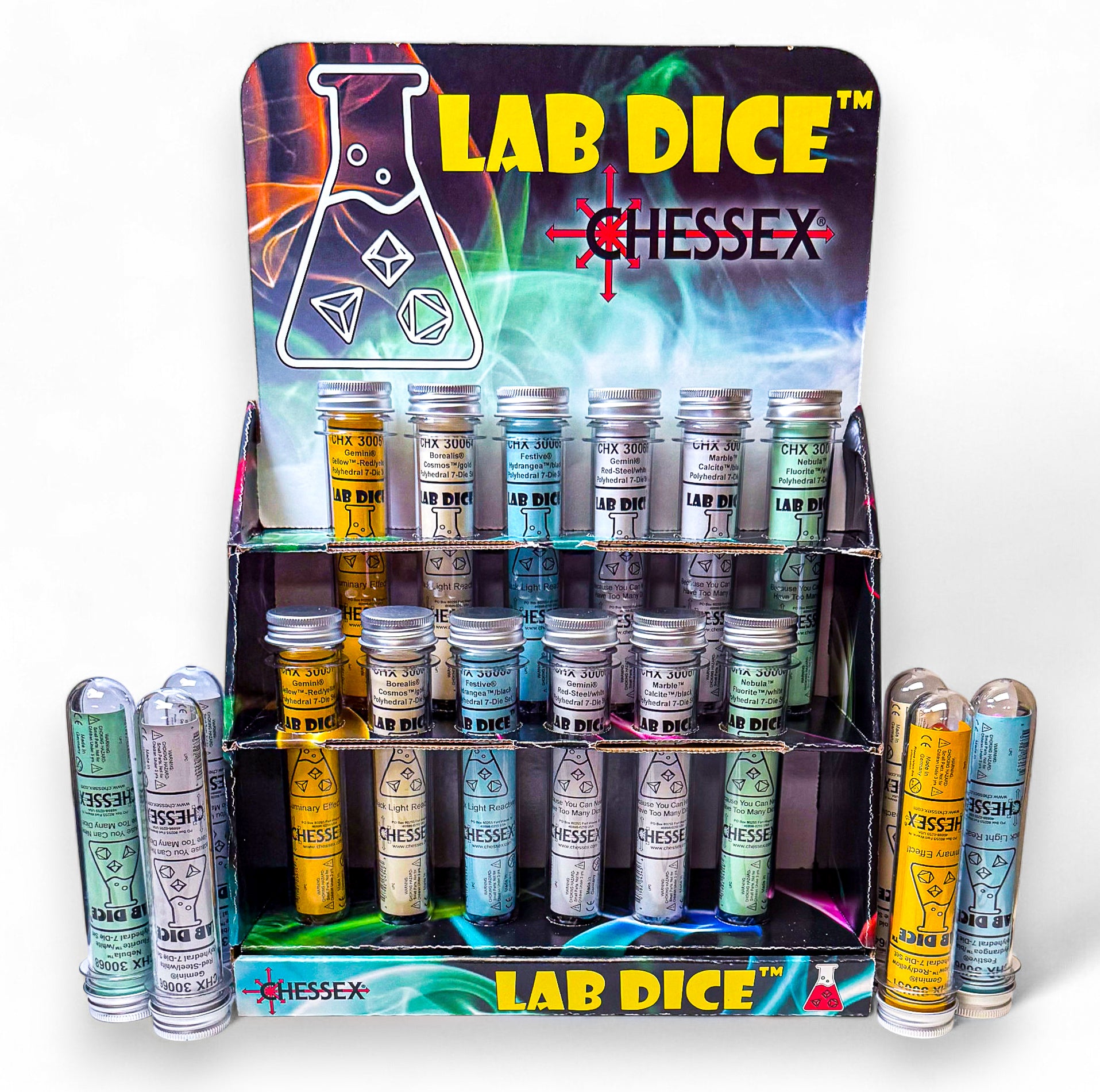 A colourful retail display holds many clear tubes of "Lab Dice" polyhedral dice, featuring a beaker icon and Chessex branding