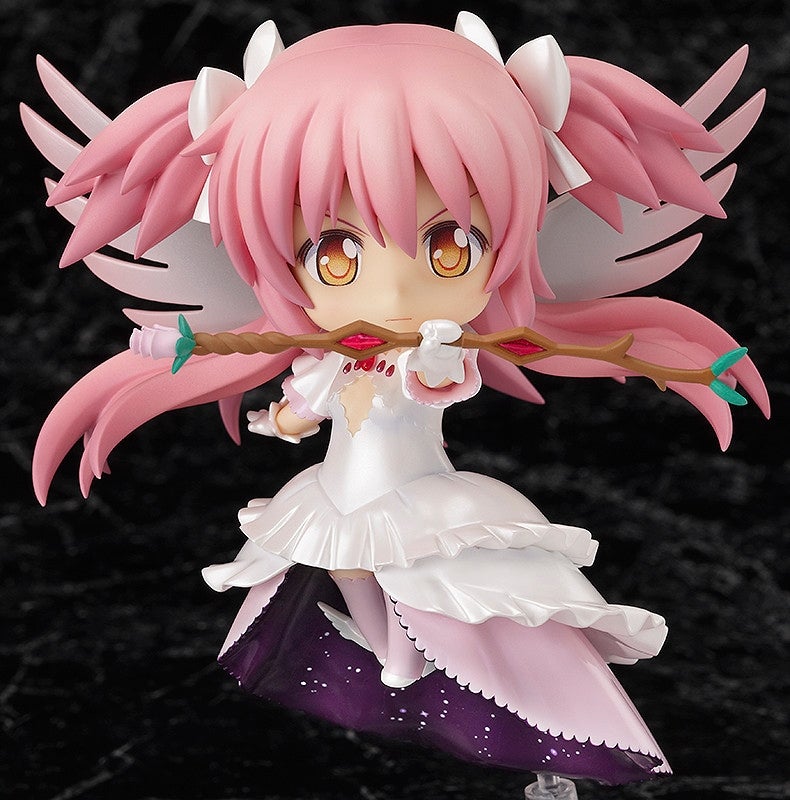 Pink-haired anime figure with white wings, white and purple dress, holding an ornate staff