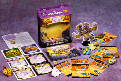 King of Tokyo Luchador Monster Pack box, a monster standee in a wrestling mask, game cards, and tokens.