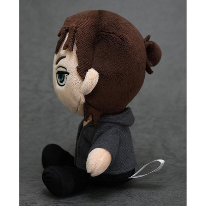 Onyankopon plushie from Attack on Titan wearing a gray hooded jacket and black pants sitting and looking left