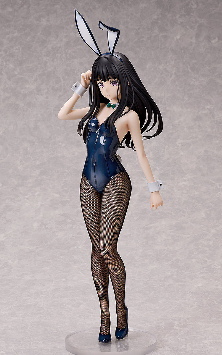 A Lycoris Recoil Takina Inoue figure with black hair, purple eyes, wearing a shiny dark blue bunny suit, fishnet stockings, and heels, standing on a clear base