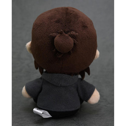 Attack on Titan Onyankopon plushie in a dark grey hoodie with brown hair tied in a bun sitting and facing away