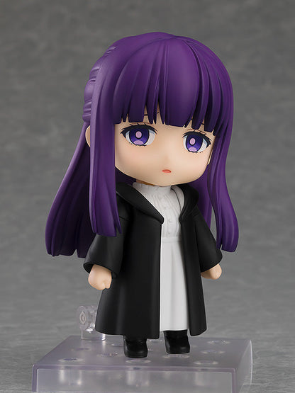 Good Smile Company Nendoroid Fern figure from Frieren Beyond Journey's End depicting the character with purple hair and eyes wearing a black coat over a white dress