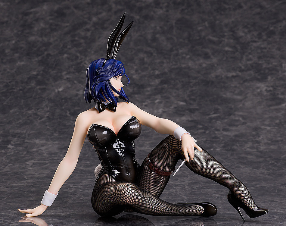 Blue-haired anime figure in black bunny suit, fishnets, and heels, seated, holding a dagger