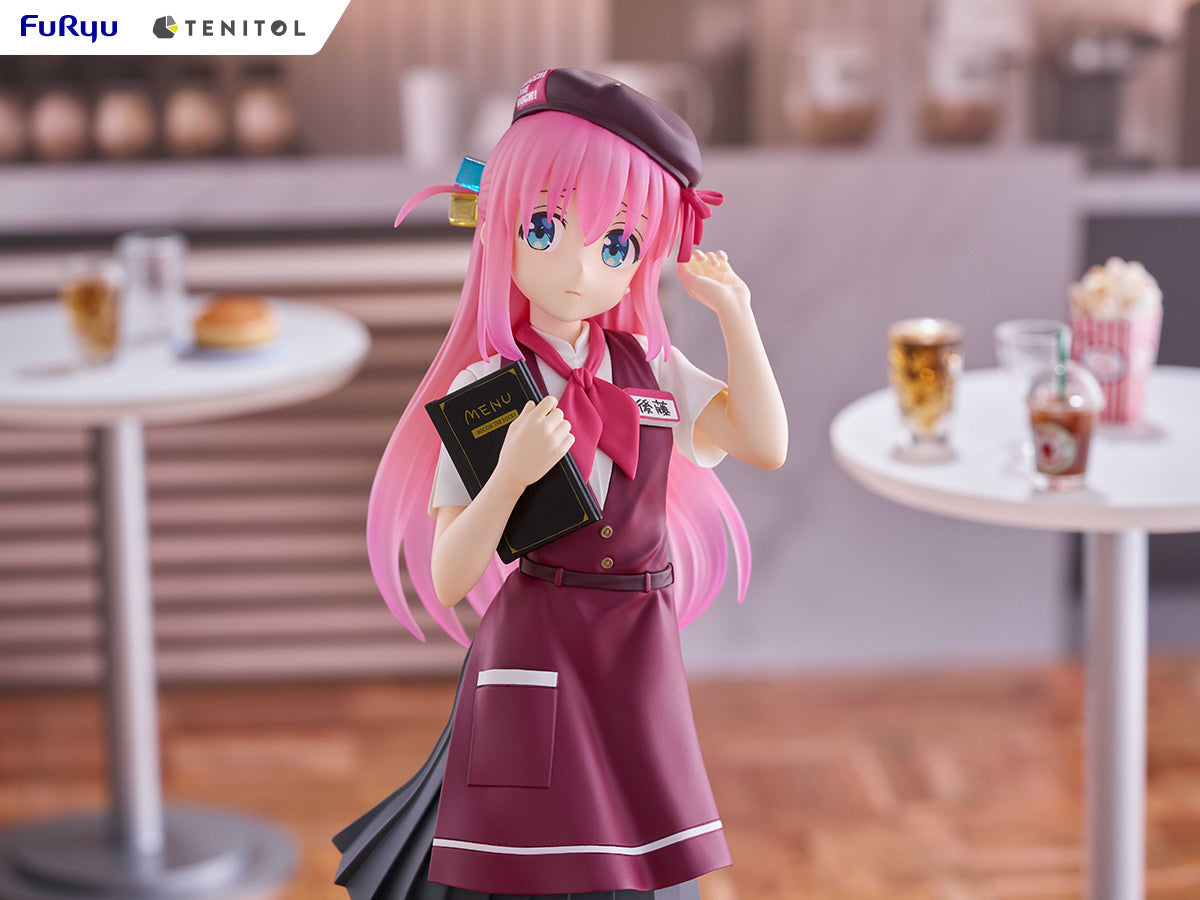 Pink-haired anime figure wearing a waitress uniform and beret, holding a menu in a cafe