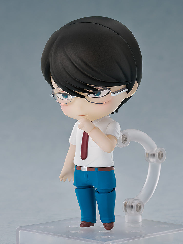 Nendoroid-style male figure in glasses, white shirt, red tie, blue pants, posing thoughtfully