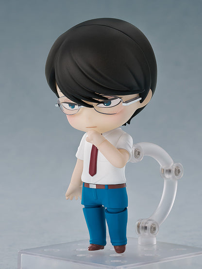 Nendoroid-style male figure in glasses, white shirt, red tie, blue pants, posing thoughtfully