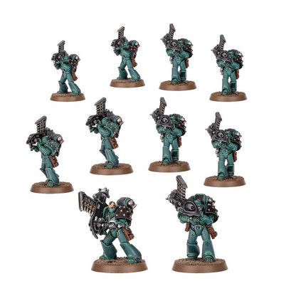Ten dark green Space Marine miniatures equipped with heavy weapons and power packs, displayed against white
