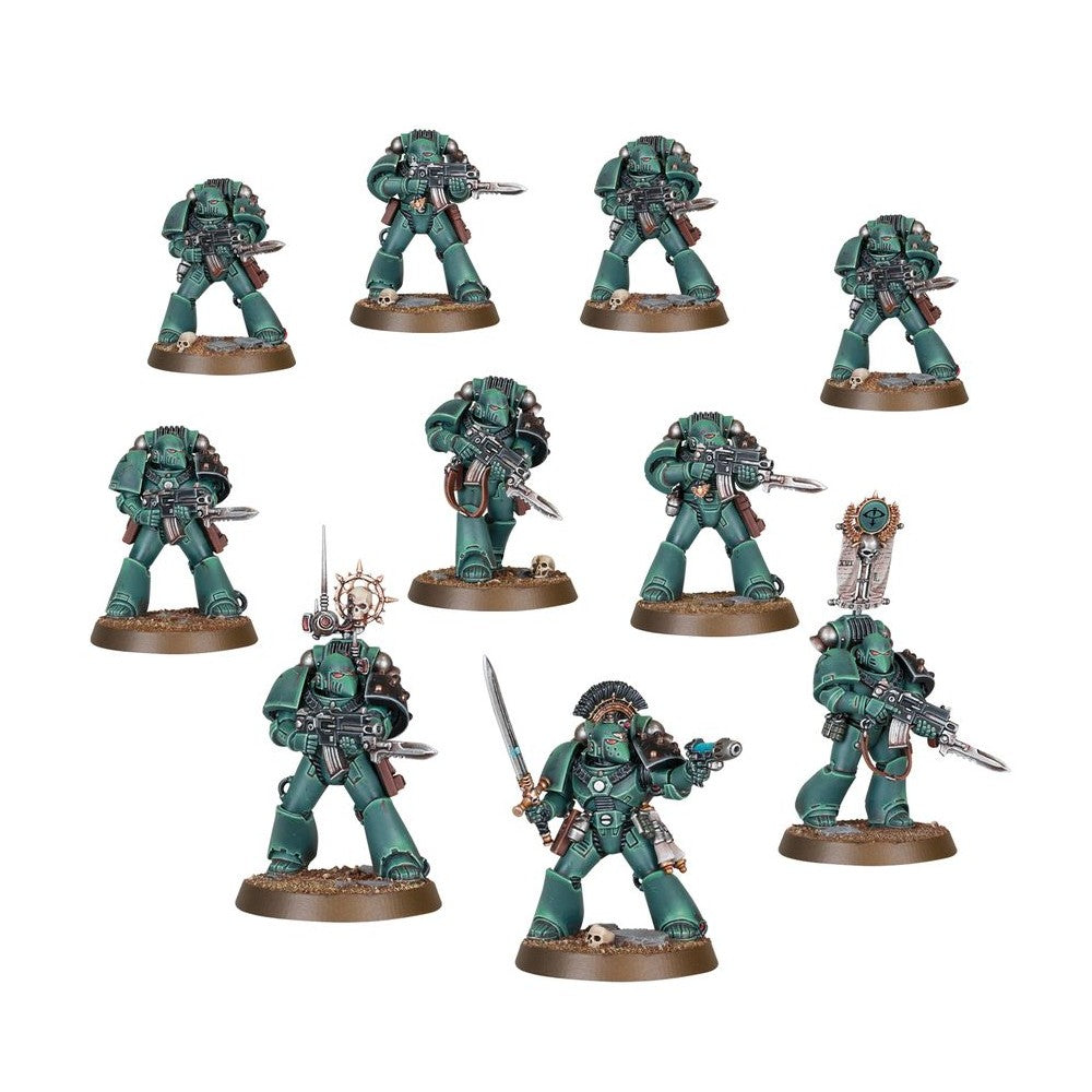 Nine dark green miniature Space Marine infantry models with rifles and squad leader equipment on scenic bases