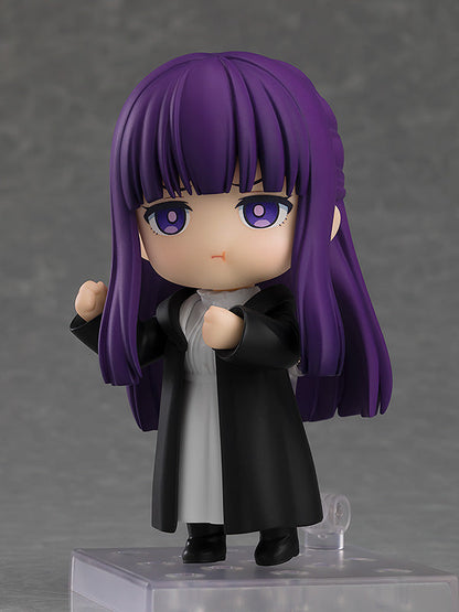 Good Smile Company Nendoroid Fern figure from Frieren Beyond Journey's End with long purple hair wearing a black coat and white dress in a determined pose