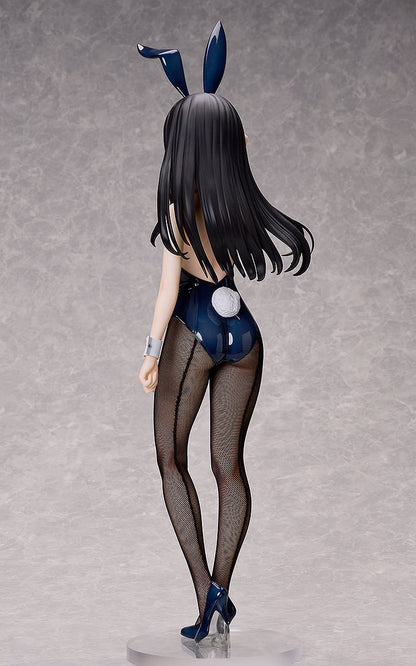A Takina Inoue bunny version figure from the back, showing dark hair, bunny ears, a dark blue suit with a white tail, fishnet stockings, and high heels