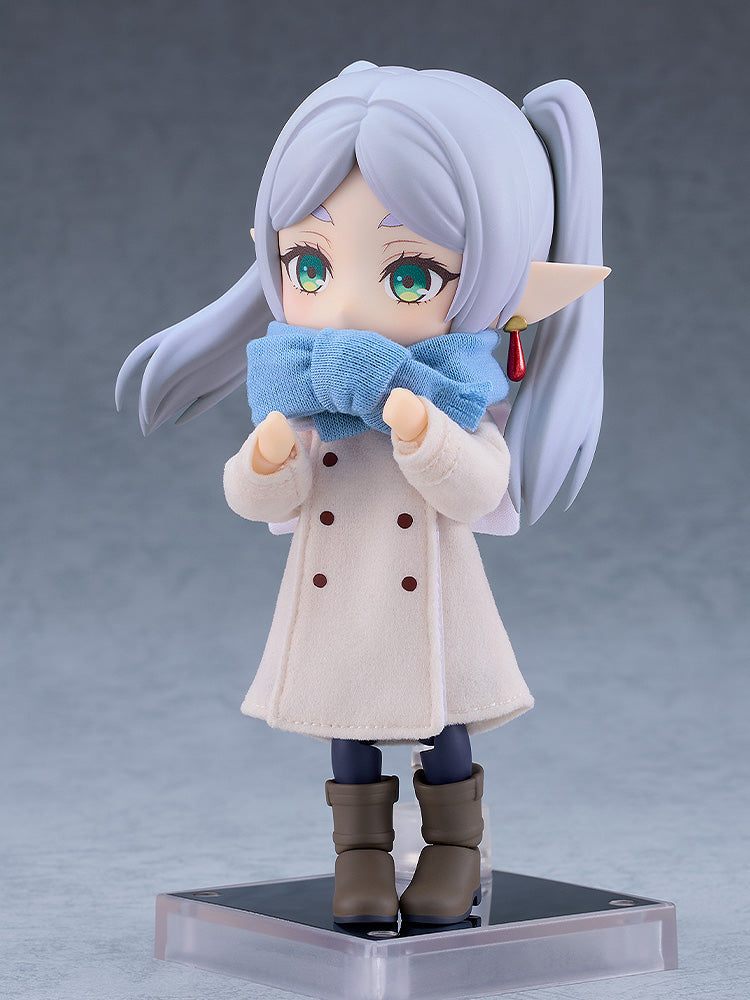 Nendoroid Doll Frieren figure in a white winter coat light blue scarf brown boots and long silver hair holding her hands to her face