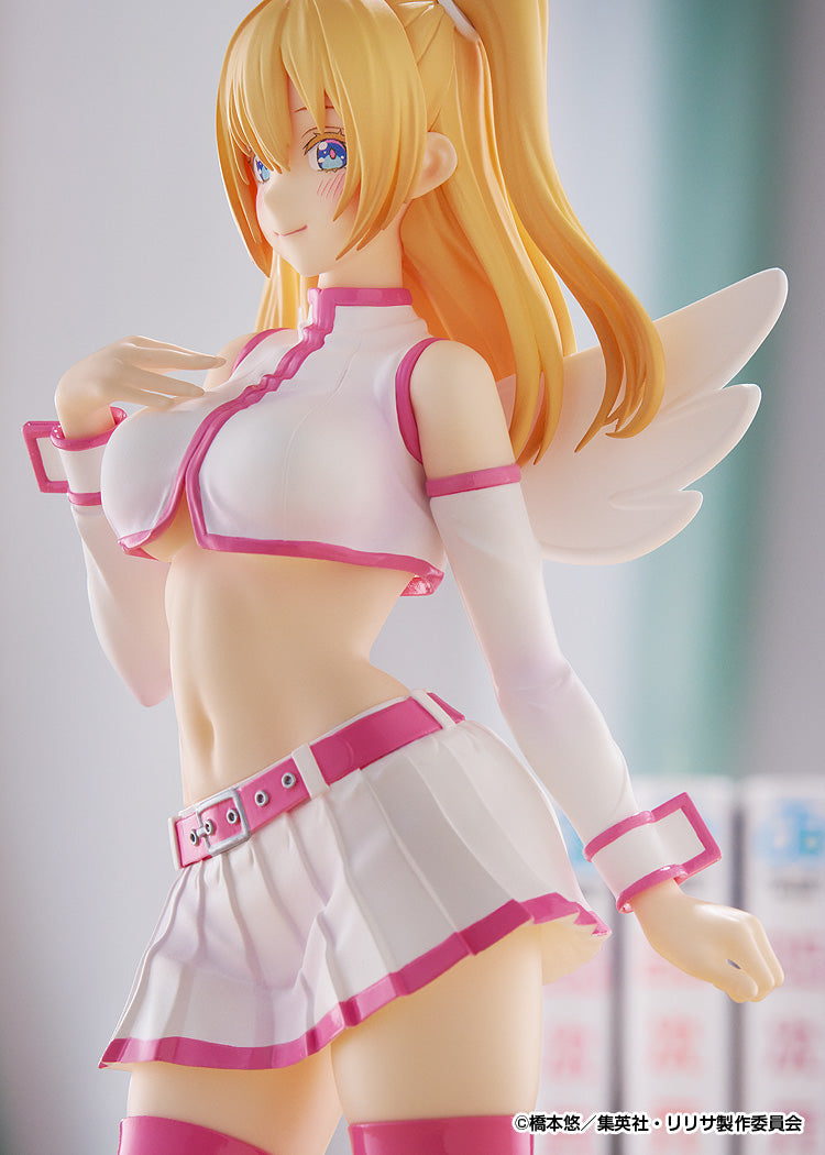 Blonde anime figure with blue eyes, white angel wings, wearing a pink and white crop top and pleated skirt, smiling