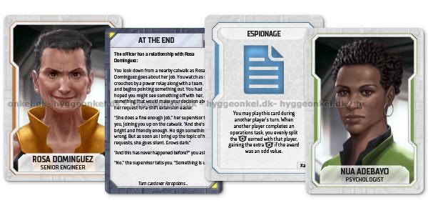 Close up of two cards from a board game The left card features a portrait of a woman and the right of this card is a portrait of a dark-skinned woman
