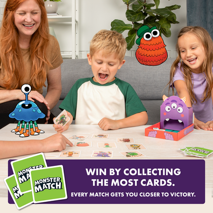 A woman and two kids happily play the Monster Match card game, surrounded by animated monsters