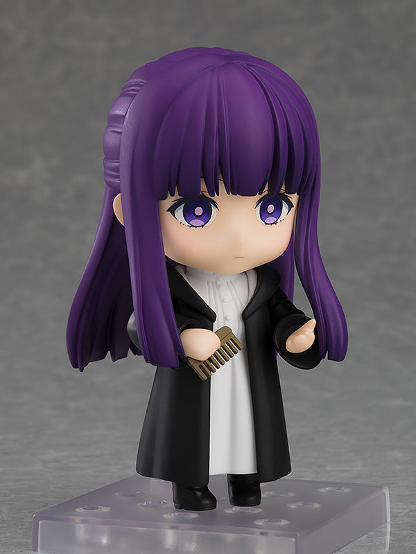 Good Smile Company Nendoroid Fern figure from Frieren Beyond Journey's End with purple hair and black coat holding a small brown comb
