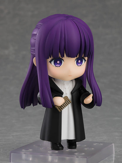 Good Smile Company Nendoroid Fern figure from Frieren Beyond Journey's End with purple hair and black coat holding a small brown comb
