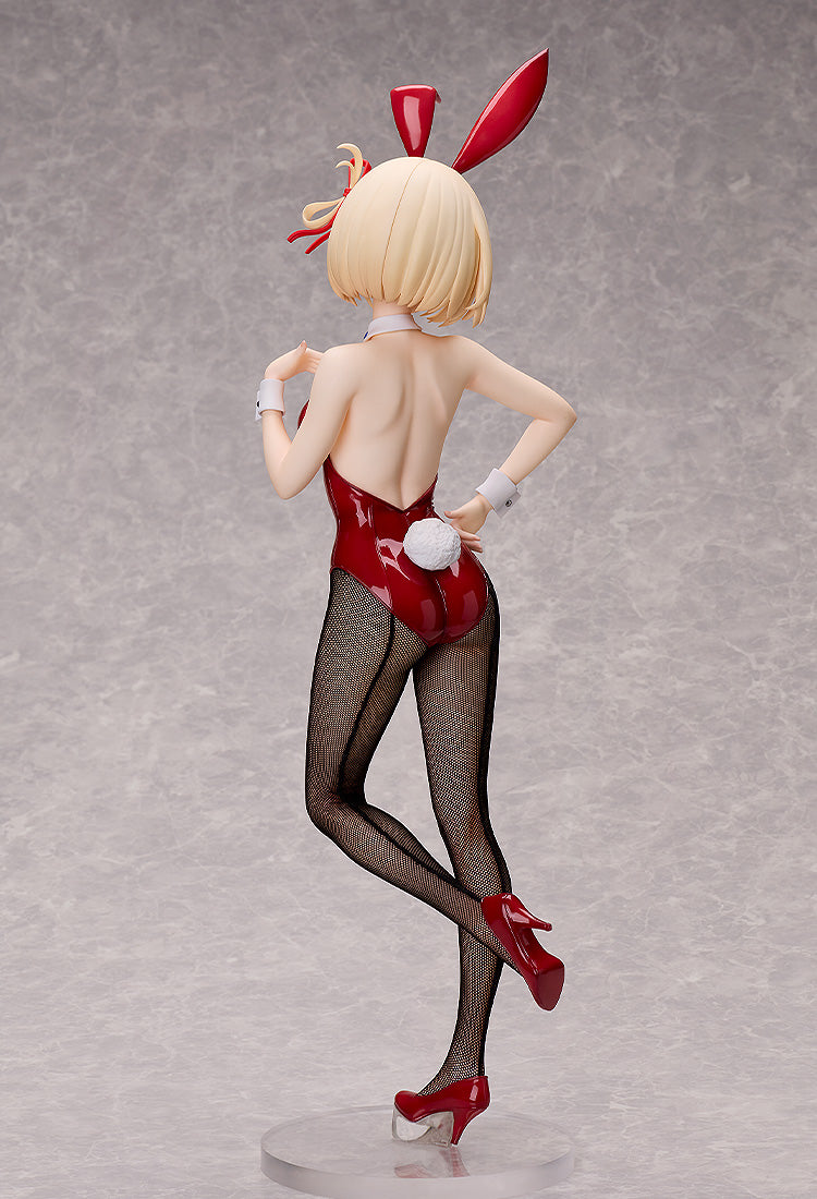 A blonde bunny girl figure in a red suit, black fishnet stockings, and red heels, viewed from the back