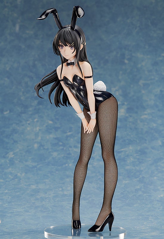 Anime figure of a woman in a black shiny bunny suit with fishnet stockings and black heels