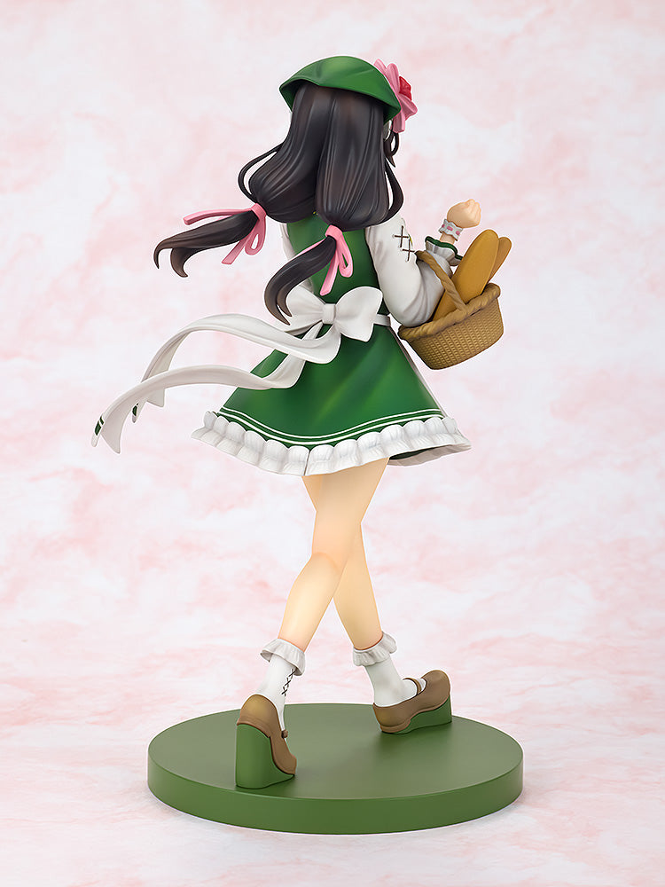 Yunyun Light Novel 10th Anniversary figure from behind, dressed in green with a beret, apron, white ruffled socks, and holding a basket of baguettes