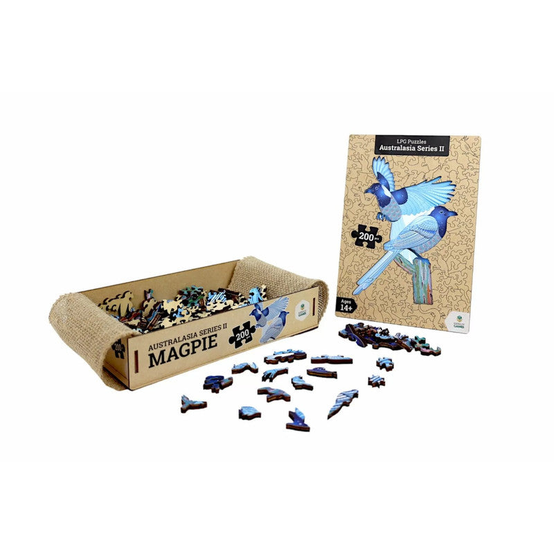An Australasian Magpie wooden puzzle set: an open box, scattered pieces, and the box cover with two magpies