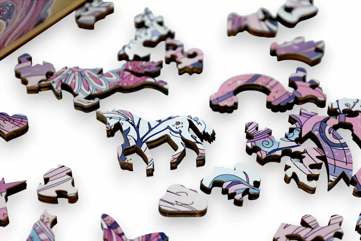 Colorful wooden jigsaw puzzle pieces, including horse, rainbow, and cat shapes, scattered on white