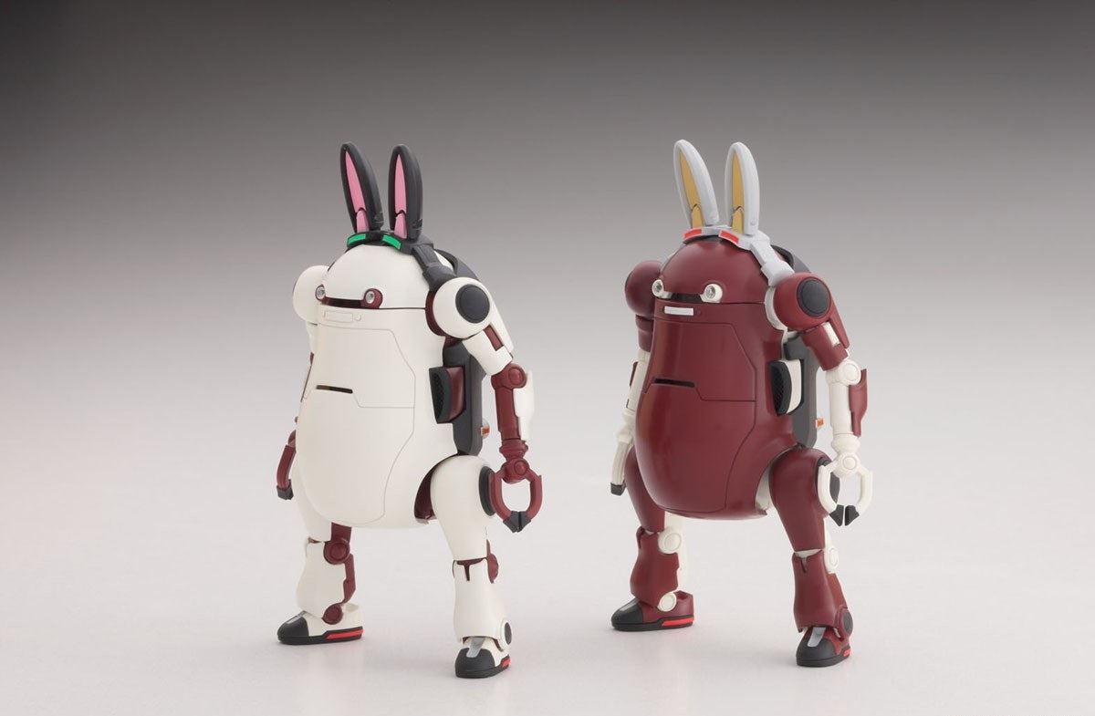 White and maroon bunny-eared robot models (mecha) standing, featured in a studio photo