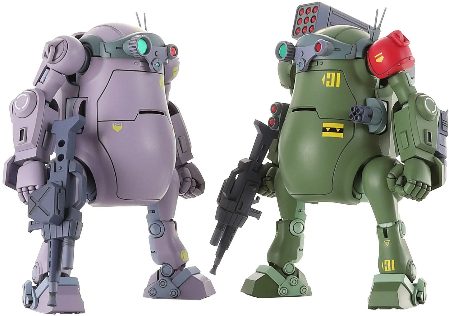 Two bulky, armored mecha figures, lavender and olive green, holding rifles. The green figure has missile pods
