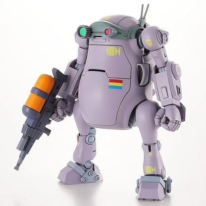 Stout lavender robot model holding a large rifle with an orange canister attachment, standing on white
