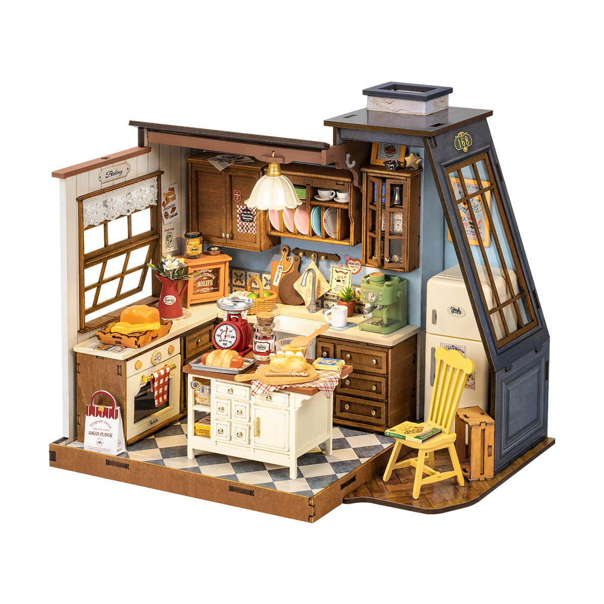 Detailed wooden miniature model of a vintage baking kitchen, featuring an island, oven, fridge, and baking items