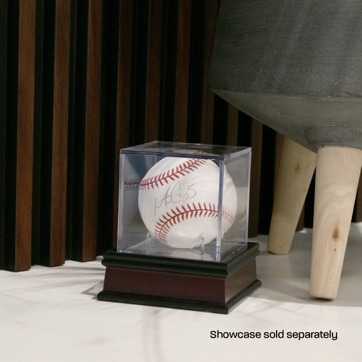BCW - Wood Base holding a baseball showcase on a table