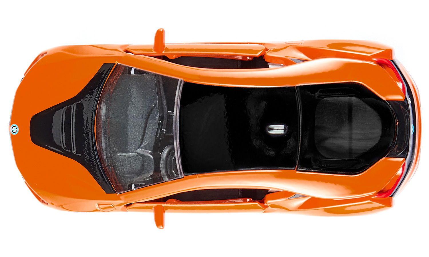 Orange sports car model with black details, viewed directly from above