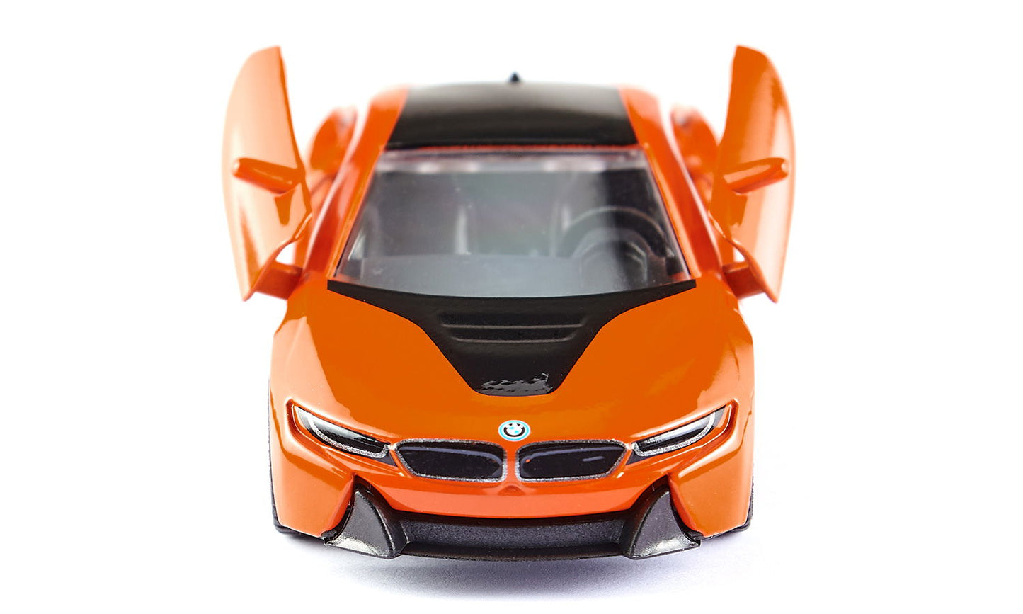 Front view of an orange sports car model with black roof and both gull-wing doors raised, against a white background