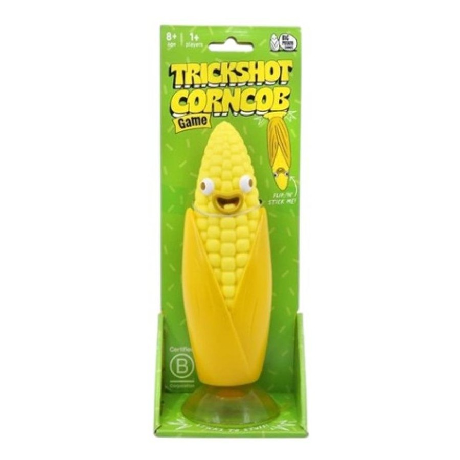 Cartoonish yellow corncob toy with a face, packaged for the "Trickshot Corncob Game"