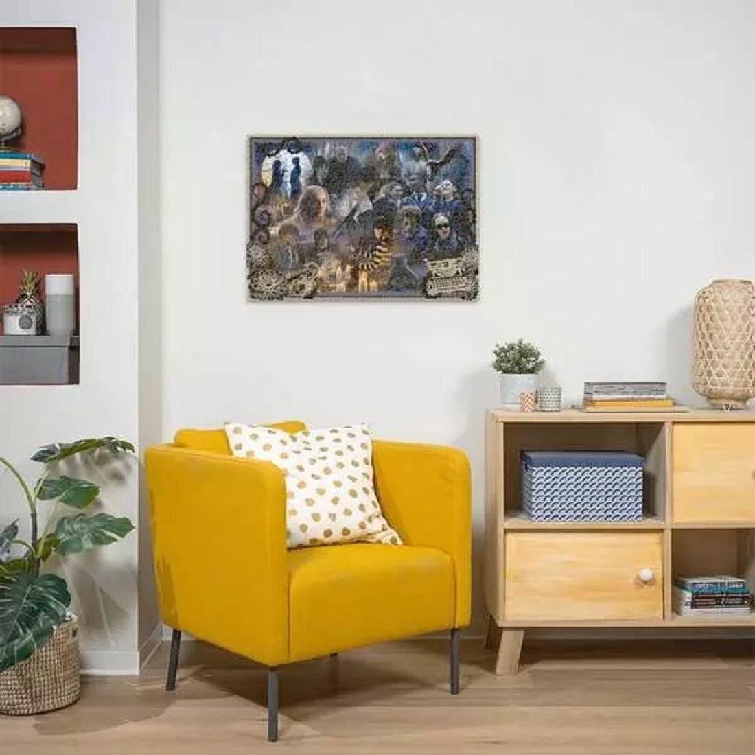 Yellow accent chair in a modern room under a large, framed collage picture