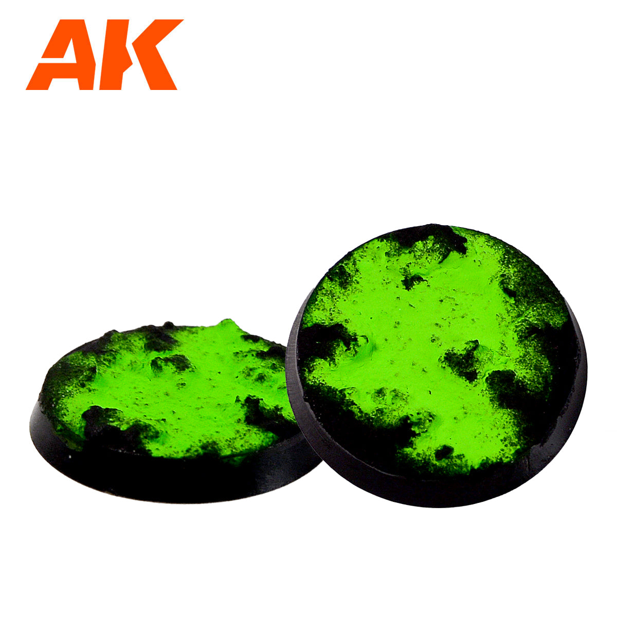Two black, round miniature bases with vibrant, textured neon green and black mottled toxic terrain