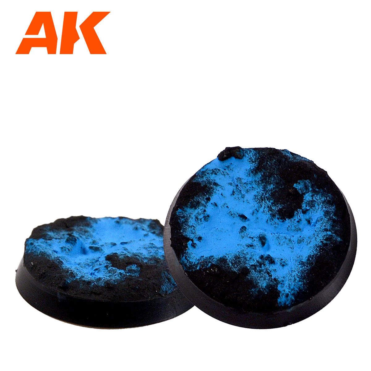 Two round miniature bases with textured black and vibrant blue cracked terrain
