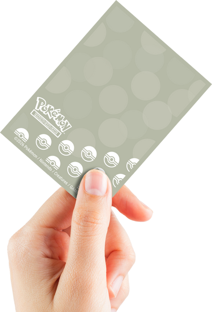 Pokémon TCG card sleeve held by a hand, showing the logo and Poké Ball icons