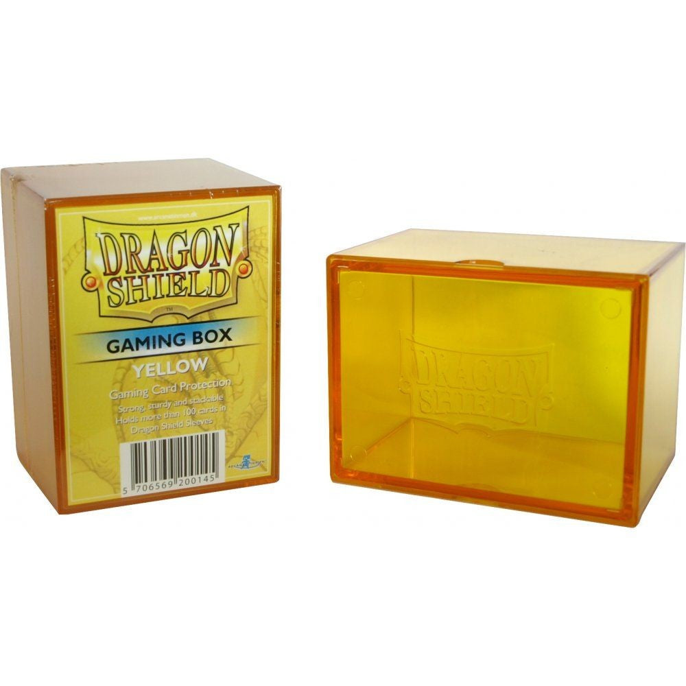 Two yellow Dragon Shield Gaming Boxes. One in its retail packaging, the other open and empty.