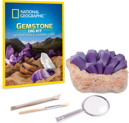 National Geographic Gemstone Dig Kit with purple crystal geode, learning guide, sculpting tool, brush, and magnifying glass