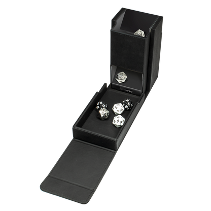 An open black dice storage box revealing various polyhedral gaming dice in a tray and a top compartment