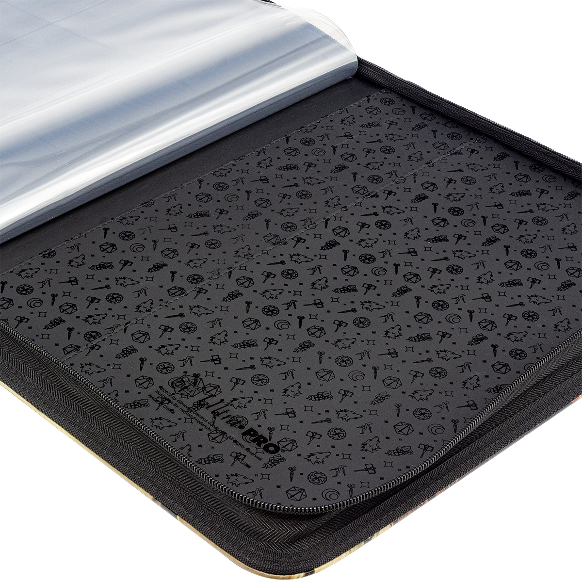 Open black trading card binder revealing clear empty sleeves and a dark interior patterned with fantasy icons, including a visible Ultra PRO logo