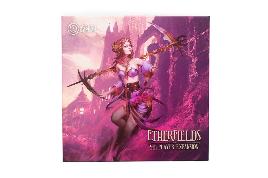 Etherfields 5th Player Expansion board game box featuring a mystical woman in purple attire holding two curved scythes against a pink and purple fantasy landscape