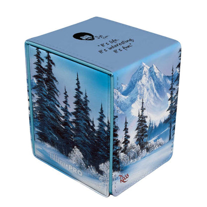 Bob Ross winter landscape deck box featuring snowy mountains, pine trees, and a quote on the lid