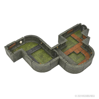 Miniature S-shaped dungeon terrain with Grey stone walls, green grassy floors, and brown wooden paths