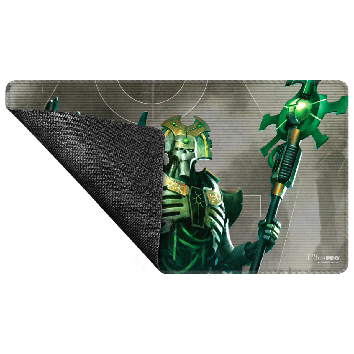 Warhammer 40K Necron playmat featuring a skeletal figure in green and gold armor, holding a staff. Corner folded to show black rubber backing