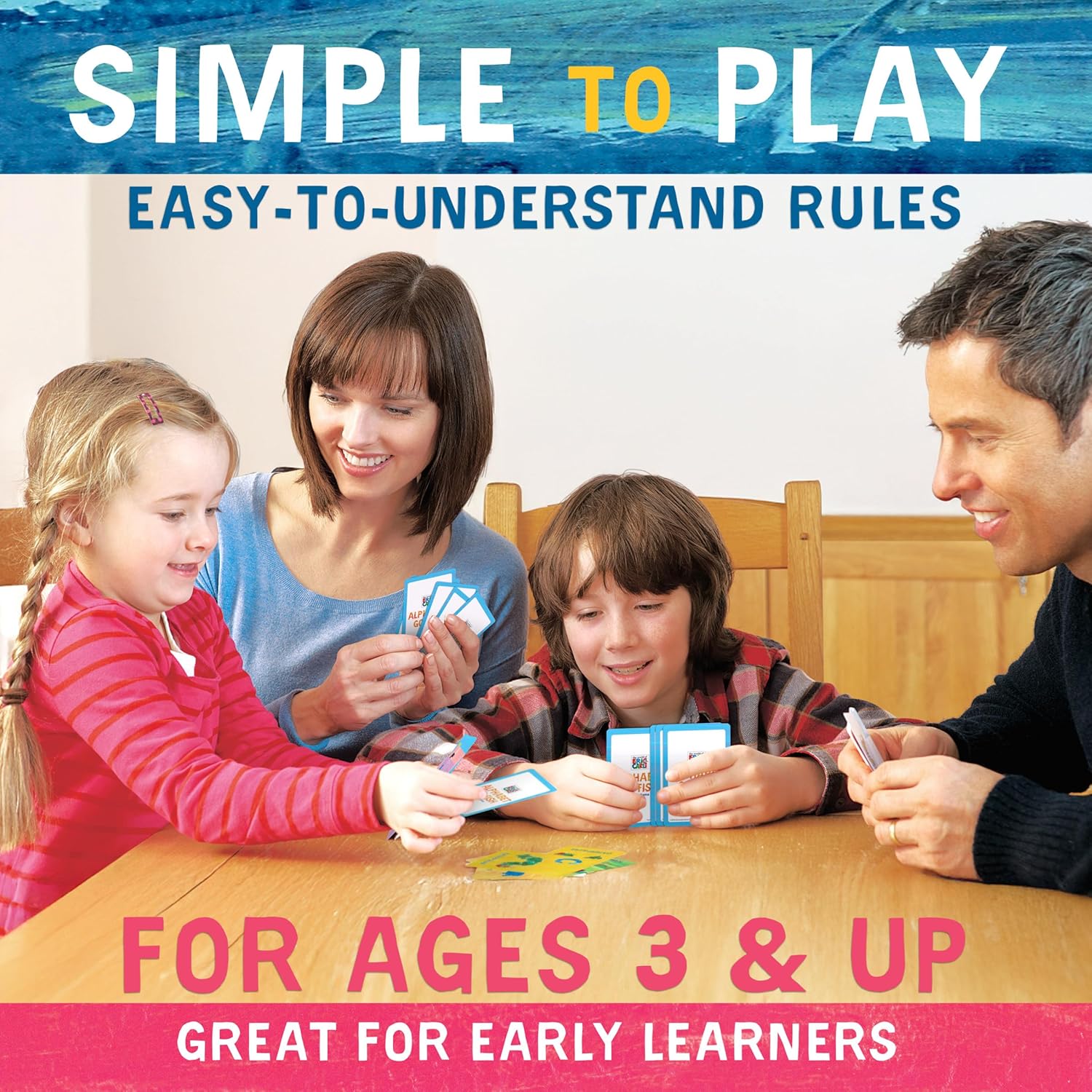 Smiling family of four playing an educational card game