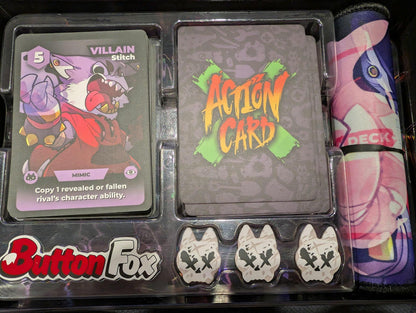 Components of the Frayed Ally: A Crafty Battle Royale  card game: Villain Stitch card, Action cards, fox tokens, and a rolled pink playmat